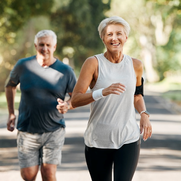 senior couple running full of energy